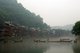 China: Boatmen early morning on Fenghuang's misty Tuo River, Fenghuang, Hunan Province